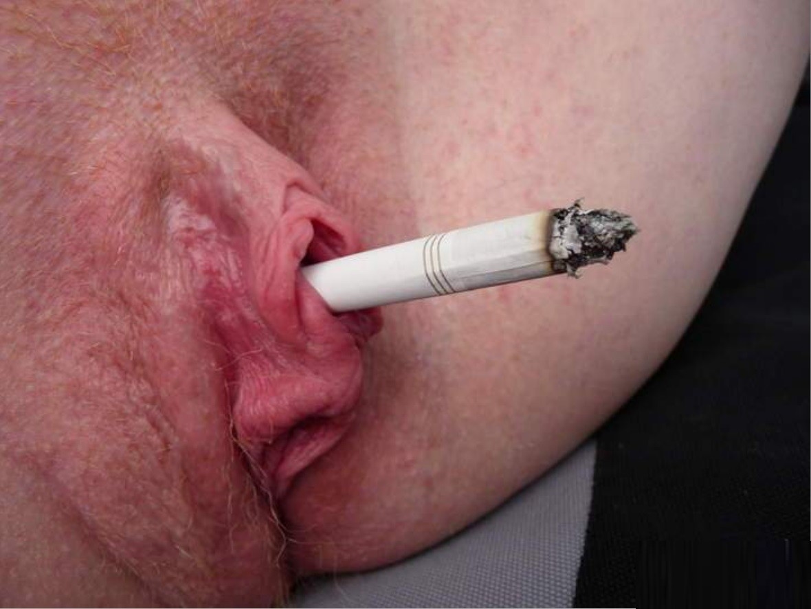 Smoking cigarette with vibrator pussy